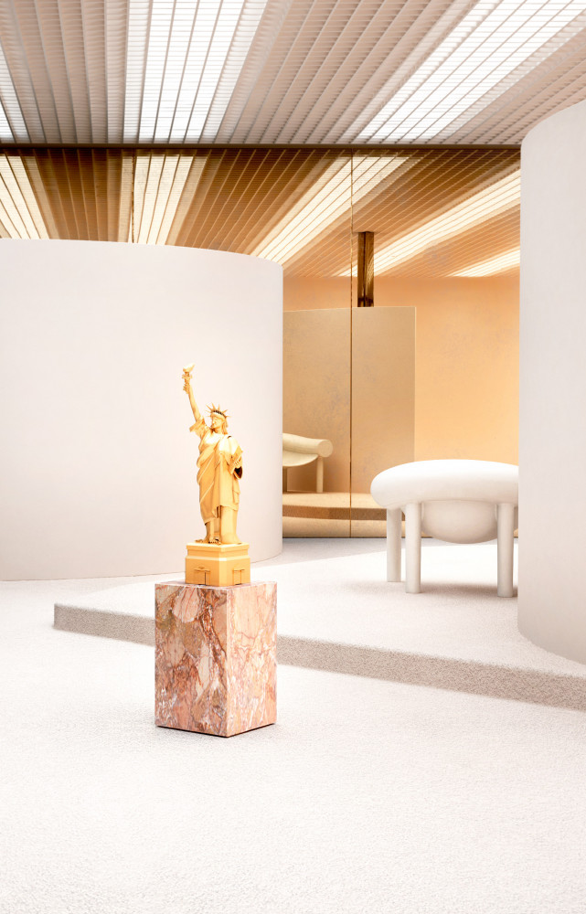 Table d’appoint en marbre rose posée sur roulettes invisibles « Qbic » de Patrick Draenert, (Draenert). Fauteuil...
