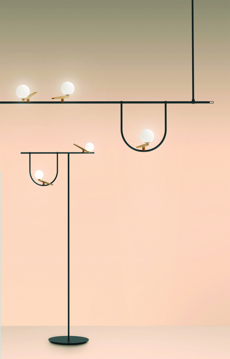 Luminaire Yanzi signé Neri&Hu fait briller des oiseaux de lumière sur des fils.