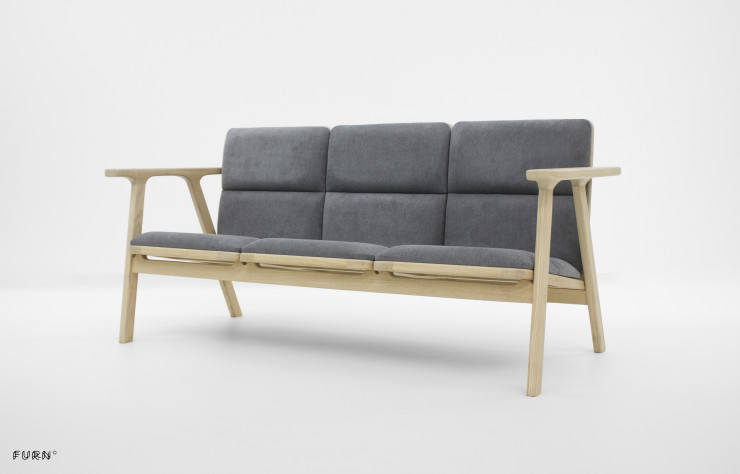 Le fauteuil existe également en version canapé.