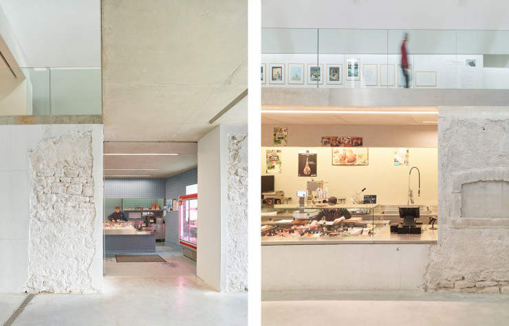 Dans la halle, les rares vestiges de la structure préexistante dialoguent avec la nouvelle architecture de béton.