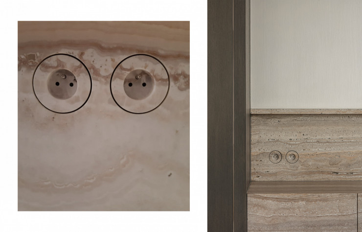 Détail des prises incrustées dans le marbre dans la continuité du veinage de la pierre.
