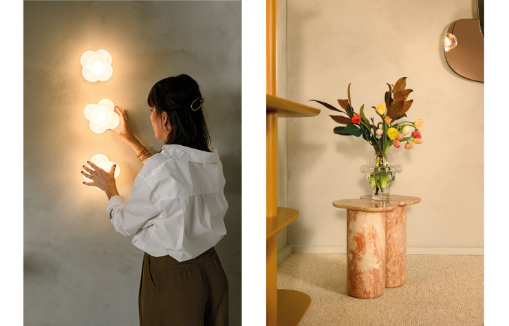 À gauche, Margaux Keller ajuste les appliques mimosa, véritables bijoux de mur conçus en verre soufflé et en laiton. À droite, «fani lioz» conçu en marbre Rose Lioz reprend l’iconique modèle de table d’appoint «fani».
